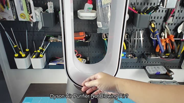White Dyson purifier on workbench White Dyson purifier on workbench