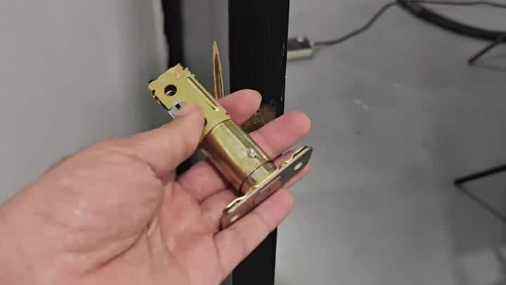 Brass latch mechanism positioned on door edge Brass latch mechanism positioned on door edge