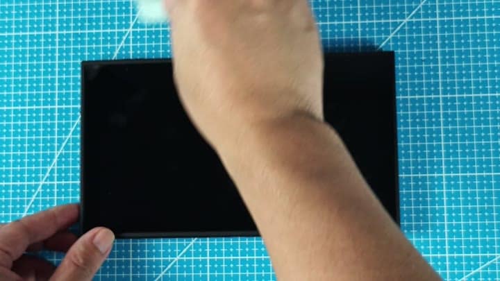 Cleaning screen with white cloth Cleaning screen with white cloth