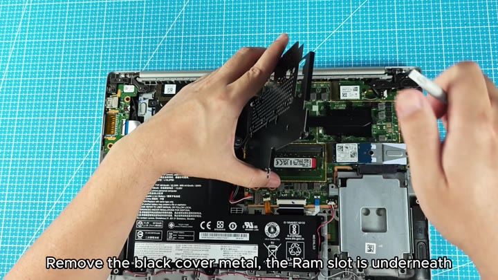 Exposed RAM slot under metal shield Exposed RAM slot under metal shield