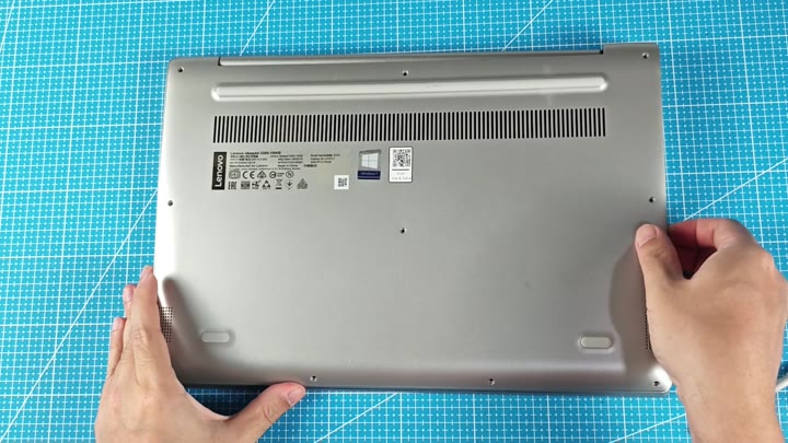 Laptop base showing vents and labels Laptop base showing vents and labels