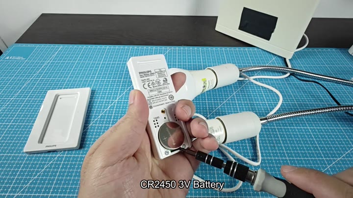 Opening battery compartment with screwdriver Opening battery compartment with screwdriver
