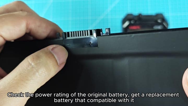 Original laptop battery terminals shown Original laptop battery terminals shown