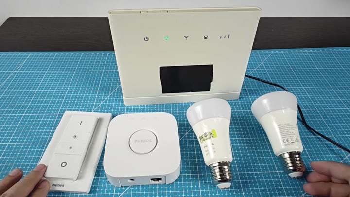 Philips Hue bridge and accessories on mat Philips Hue bridge and accessories on mat