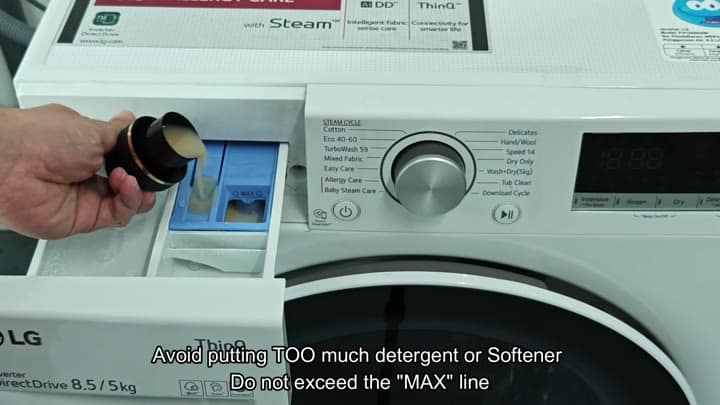 Pouring detergent into LG washer drawer Pouring detergent into LG washer drawer