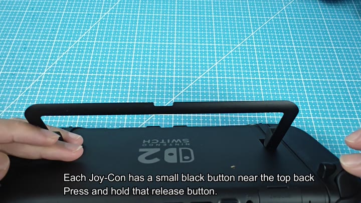 Press and hold Joy-Con release button Press and hold Joy-Con release button