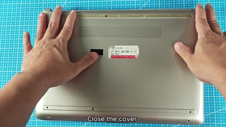 Pressing down laptop back cover Pressing down laptop back cover
