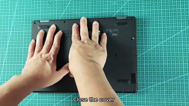 Pressing laptop cover back into place Pressing laptop cover back into place