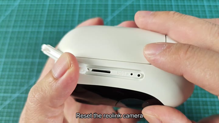 Pressing reset button on camera Pressing reset button on camera