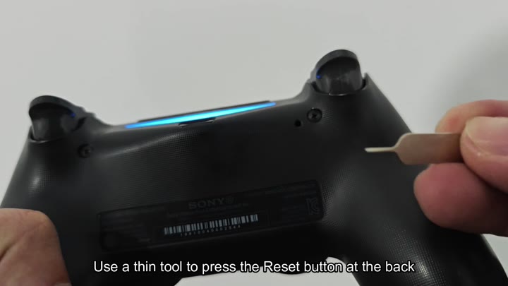 Pressing reset button on controller back Pressing reset button on controller back