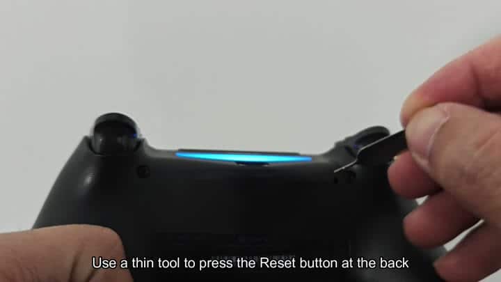 Pressing reset button on controller back Pressing reset button on controller back