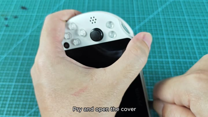 Prying open the PS Vita back cover Prying open the PS Vita back cover
