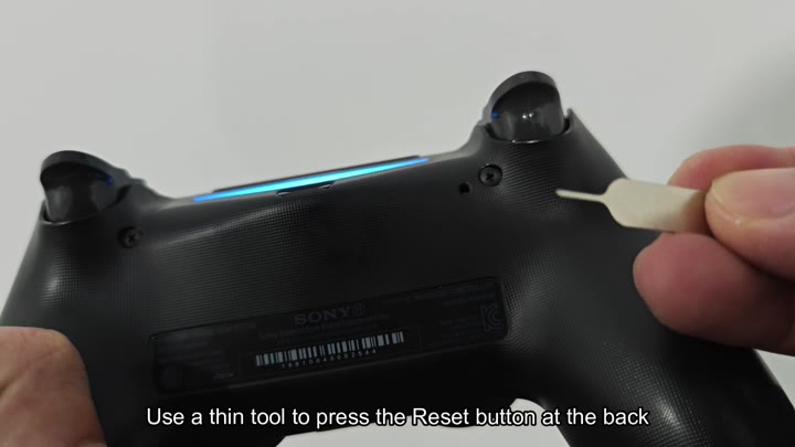 PS5 controller reset button on back PS5 controller reset button on back