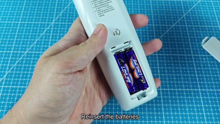 Reinsert AA batteries into remote control Reinsert AA batteries into remote control