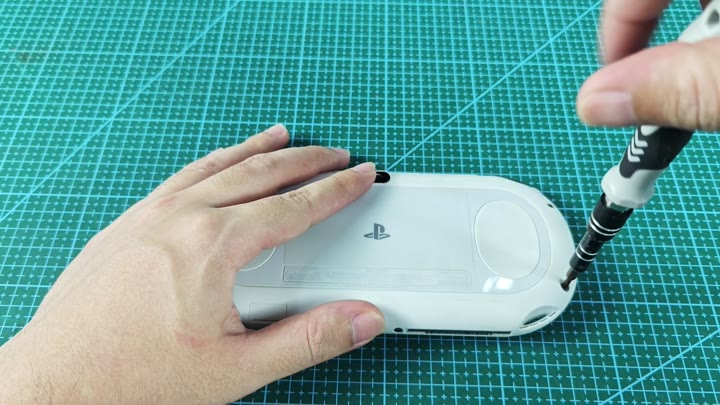 Unscrewing PS Vita back panel Unscrewing PS Vita back panel