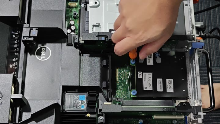 Using screwdriver on server riser card Using screwdriver on server riser card